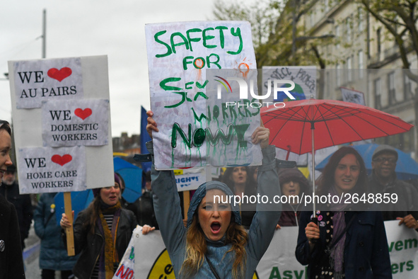 A young woman holds 'Safety for Sex Workers Now!' sign during an annual May Day march for workers' rights.
On Tuesday, May 1, 2018, in Dubli...