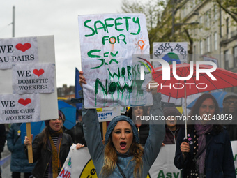 A young woman holds 'Safety for Sex Workers Now!' sign during an annual May Day march for workers' rights.
On Tuesday, May 1, 2018, in Dubli...