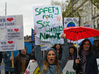 A young woman holds 'Safety for Sex Workers Now!' sign during an annual May Day march for workers' rights.
On Tuesday, May 1, 2018, in Dubli...