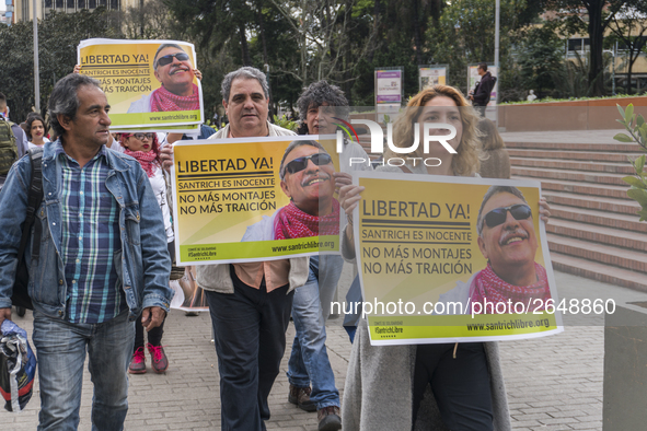 People with posters, asking for the release of Jesus Santrich, member of the FARC-EP, on Labor Day in Bogotá, Colombia, on May 1, 2018. 