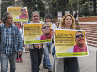 People with posters, asking for the release of Jesus Santrich, member of the FARC-EP, on Labor Day in Bogotá, Colombia, on May 1, 2018. (