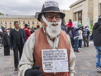 A person with posters at the Labor Day protest in Bogota, Colombia, on May 1, 2018. (