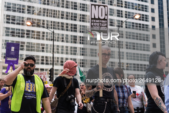 Demonstrators march towards the Thompson Center for May Day, also known as International Workers’ Day, in Chicago on May 1, 2018. 