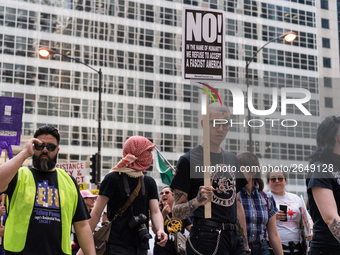 Demonstrators march towards the Thompson Center for May Day, also known as International Workers’ Day, in Chicago on May 1, 2018. (