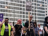 Demonstrators march towards the Thompson Center for May Day, also known as International Workers’ Day, in Chicago on May 1, 2018. (