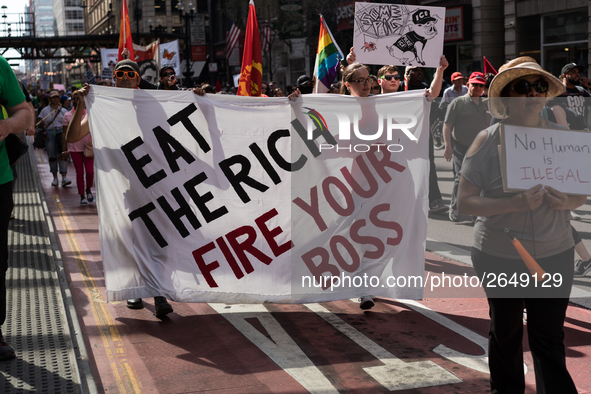 Demonstrators march towards the Thompson Center for May Day, also known as International Workers’ Day, in Chicago on May 1, 2018. 