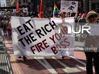 Demonstrators march towards the Thompson Center for May Day, also known as International Workers’ Day, in Chicago on May 1, 2018. (