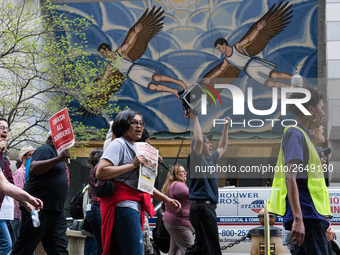 Demonstrators march towards the Thompson Center for May Day, also known as International Workers’ Day, in Chicago on May 1, 2018. (