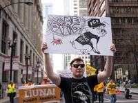 A demonstrator marches towards Immigration and Customs Enforcement's (ICE) Chicago headquarters for May Day, also known as International Wor...