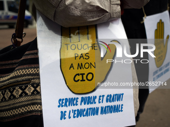 A placard reading 'Don't touch my CIO, public and free services for education' as Macron plans their closures. CIO is the ancronym for Cente...