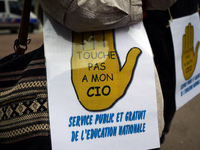 A placard reading 'Don't touch my CIO, public and free services for education' as Macron plans their closures. CIO is the ancronym for Cente...