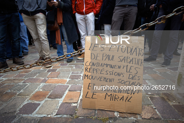 A cardboard reading 'Students from Paul Sabatier University condemn repression of social movements and support Le Mirail university'. Severa...