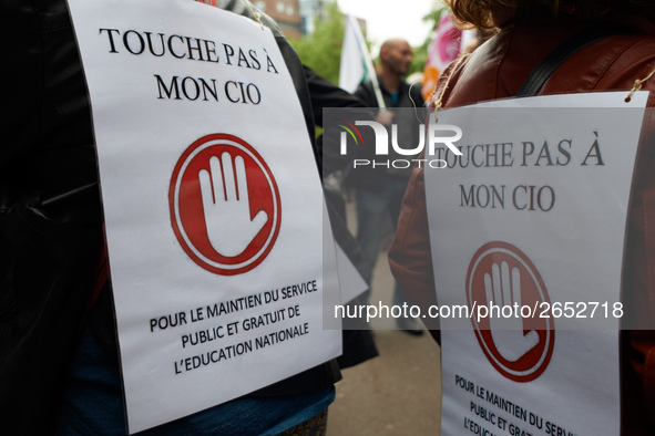 Placards reading 'Don't touch my CIO, public and free services for education' as Macron plans their closures. CIO is the ancronym for Center...