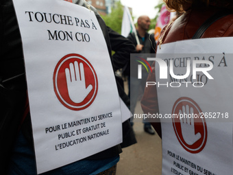 Placards reading 'Don't touch my CIO, public and free services for education' as Macron plans their closures. CIO is the ancronym for Center...