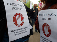 Placards reading 'Don't touch my CIO, public and free services for education' as Macron plans their closures. CIO is the ancronym for Center...