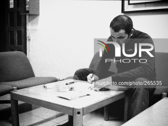 Borja, pilgrim cyclist, plans the route for the next day, at the hostel, in Laransoana, Spain, on December 2004 (