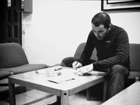 Borja, pilgrim cyclist, plans the route for the next day, at the hostel, in Laransoana, Spain, on December 2004 (