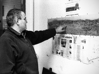 Juan, Spanish pilgrim  studying the map of the path shown in the living room of the hostel, in Laransoana, Spain, on December 2004 (