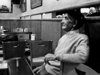 An elderly man in a bar after dinner, in Laransoana, Spain, on December 2004  (