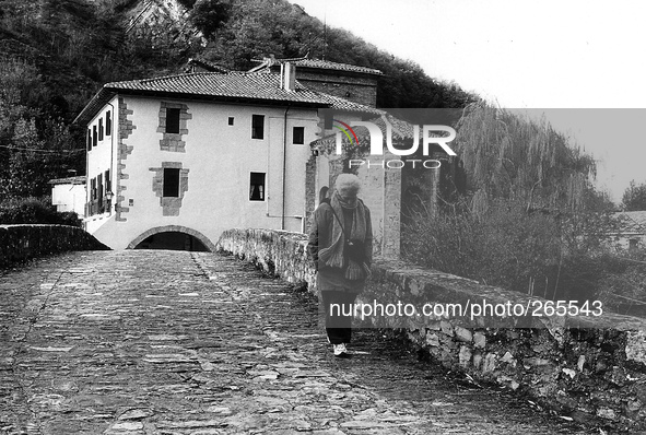 The bridge and the church of the Holy Trinity, in Trinidad de Arre, Spain, on December 2004 