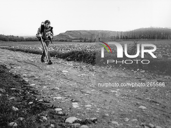 The French pilgrim Joan Cristophe, on the road to Santiago de Compostela, collects and carries the plastic waste lies along the trails, in Z...