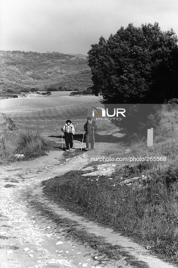 Two Catalan pilgrims along the climb to the sierra, in the Perdòn Alto, Spain, on December 2004  