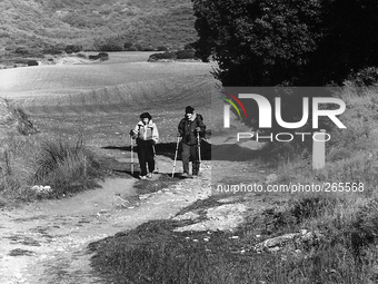 Two Catalan pilgrims along the climb to the sierra, in the Perdòn Alto, Spain, on December 2004  (