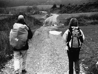 Two pilgrims crossing the hilly countryside between Ciraqui and Estella, in Lorca, Spain, on December 2004  (