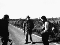 Two pilgrims asking for information on the path of the road to Santiago because of a long detour on the highway, near Torres del Rio, Spain,...