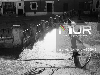 Dry the streets in the early hours of the morning, in Burgos, Spain, December 2004  (