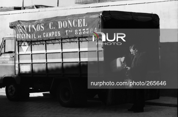 Vendor of wine in bulk, in Villamentero de Campos, Spain, on December 2004  