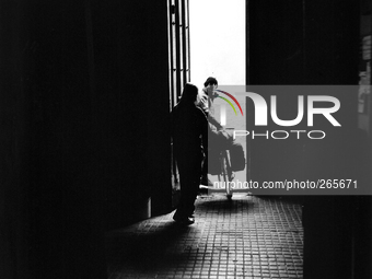 A pilgrim cyclist starts from the shelter in the early morning, in Astorga, Spain, on December 2004 (