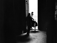 A pilgrim cyclist starts from the shelter in the early morning, in Astorga, Spain, on December 2004 (