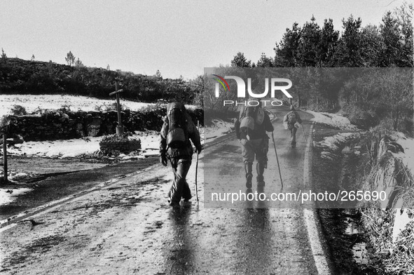 A group of pilgrims headed to Palais del Rei, in Alto del Rosario, Spain, on December 2004 