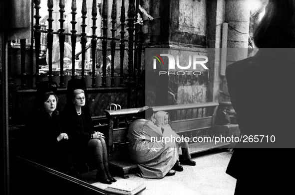 Pious Women in the cathedral during the mass arrival of the pilgrims, in Santiago de Compostela, Spain, on December 2004  