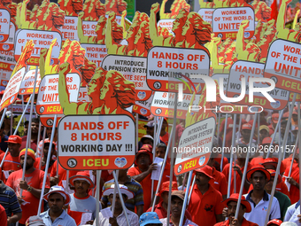 Supporters of Sri Lankan Marxist political party, People's Liberation Front, shout slogans holding placards during a parade march held to ma...