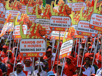 Supporters of Sri Lankan Marxist political party, People's Liberation Front, shout slogans holding placards during a parade march held to ma...