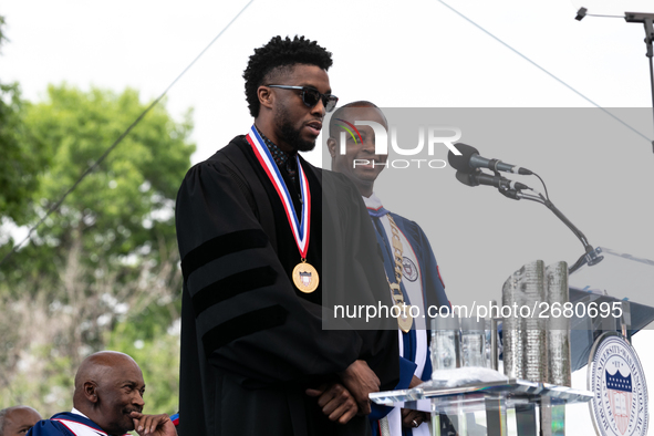 (L-R): Actor and alumnus Chadwick Boseman speaks, with Howard University President Dr. Wayne A.I. Frederick by his side, at the commencement...