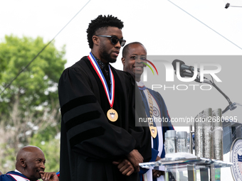 (L-R): Actor and alumnus Chadwick Boseman speaks, with Howard University President Dr. Wayne A.I. Frederick by his side, at the commencement...