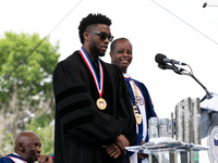 (L-R): Actor and alumnus Chadwick Boseman speaks, with Howard University President Dr. Wayne A.I. Frederick by his side, at the commencement...