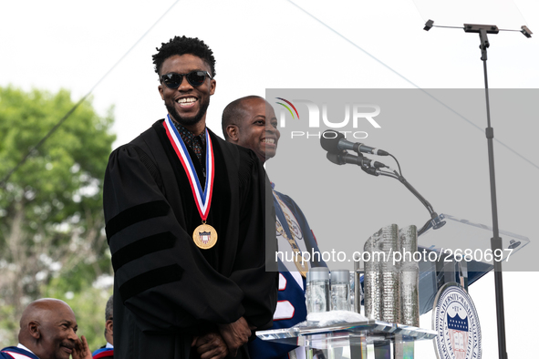 (L-R): Actor and alumnus Chadwick Boseman speaks, with Howard University President Dr. Wayne A.I. Frederick by his side, at the commencement...