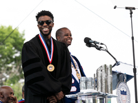 (L-R): Actor and alumnus Chadwick Boseman speaks, with Howard University President Dr. Wayne A.I. Frederick by his side, at the commencement...