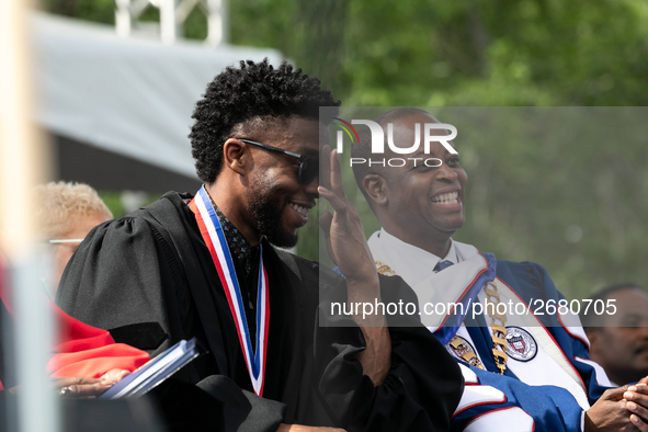 (L-R): Actor and alumnus Chadwick Boseman, and Howard University President Dr. Wayne A.I. Frederick share a laugh at the commencement ceremo...