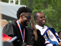 (L-R): Actor and alumnus Chadwick Boseman, and Howard University President Dr. Wayne A.I. Frederick share a laugh at the commencement ceremo...