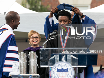 Actor and alumnus Chadwick Boseman (center), participates in a hooding receiving an honorary degree, Doctor of Humane Letters. as Howard Uni...