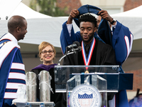 Actor and alumnus Chadwick Boseman (center), participates in a hooding receiving an honorary degree, Doctor of Humane Letters. as Howard Uni...