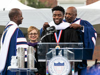 Actor and alumnus Chadwick Boseman (center), participates in a hooding receiving an honorary degree, Doctor of Humane Letters. as Howard Uni...