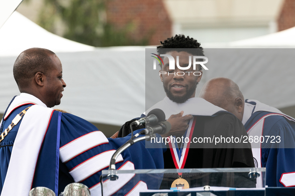 Actor and alumnus Chadwick Boseman (center), participates in a hooding receiving an honorary degree, Doctor of Humane Letters. as Howard Uni...