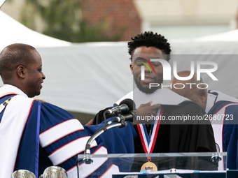 Actor and alumnus Chadwick Boseman (center), participates in a hooding receiving an honorary degree, Doctor of Humane Letters. as Howard Uni...