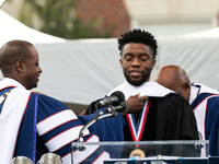 Actor and alumnus Chadwick Boseman (center), participates in a hooding receiving an honorary degree, Doctor of Humane Letters. as Howard Uni...